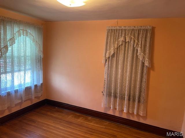5461 Eichelberger St, Saint Louis, MO 63109 - spare room with wood finished floors and baseboards