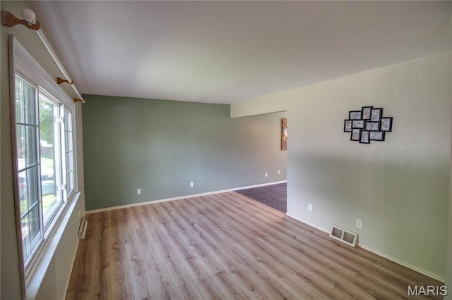 1513 Colonial Dr, Godfrey, IL 62035 - spare room featuring wood finished floors and baseboards