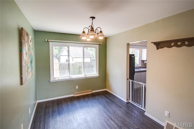 1513 Colonial Dr, Godfrey, IL 62035 - unfurnished room with a chandelier and dark wood finished floors