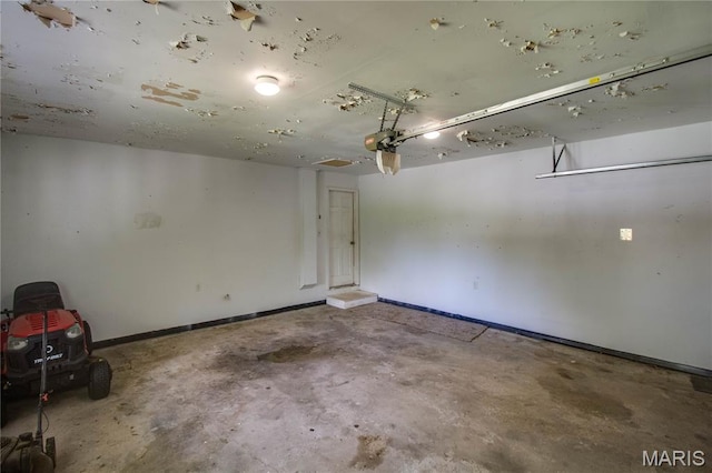 1513 Colonial Dr, Godfrey, IL 62035 - garage with a garage door opener and baseboards