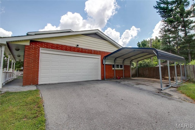1513 Colonial Dr, Godfrey, IL 62035 - garage featuring asphalt driveway and a detached carport