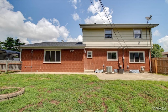 1513 Colonial Dr, Godfrey, IL 62035 - back of house with a patio area and brick siding