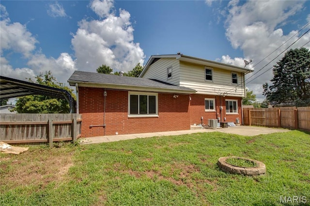 1513 Colonial Dr, Godfrey, IL 62035 - rear view of property with brick siding, a fenced backyard, and a patio