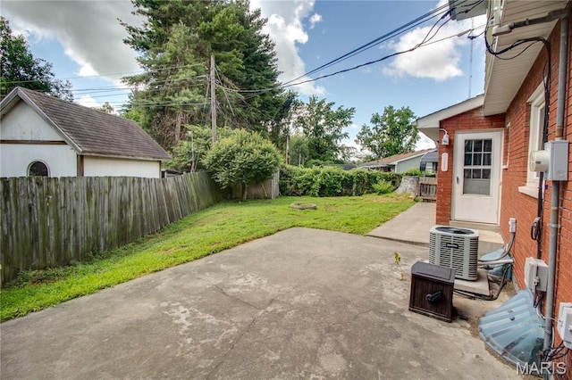 1513 Colonial Dr, Godfrey, IL 62035 - fenced backyard featuring a patio