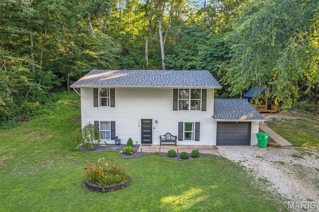 112 Dale Dr, Hillsboro, MO 63050 - view of front of home with an attached garage, gravel driveway, a front lawn, and roof with shingles