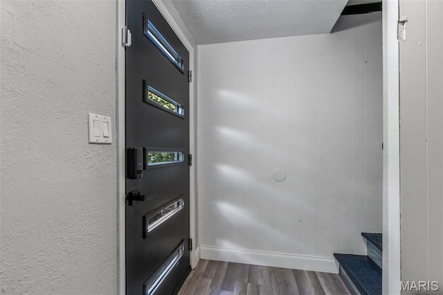 112 Dale Dr, Hillsboro, MO 63050 - entryway with wood finished floors, a textured wall, stairs, and a textured ceiling