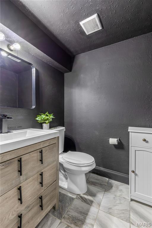 112 Dale Dr, Hillsboro, MO 63050 - half bathroom with vanity and a textured wall