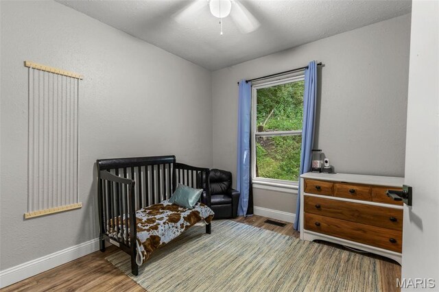 112 Dale Dr, Hillsboro, MO 63050 - bedroom with wood finished floors and a ceiling fan