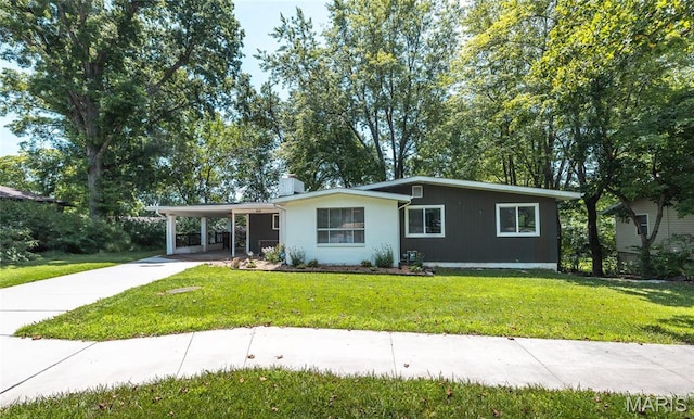 920 E 7th St, Rolla, MO 65401 - ranch-style house with a carport, concrete driveway, and a front lawn