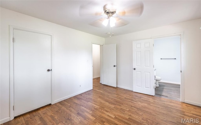 920 E 7th St, Rolla, MO 65401 - unfurnished bedroom featuring wood finished floors and ensuite bathroom