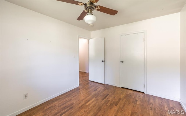 920 E 7th St, Rolla, MO 65401 - unfurnished bedroom featuring wood finished floors, a ceiling fan, and a closet