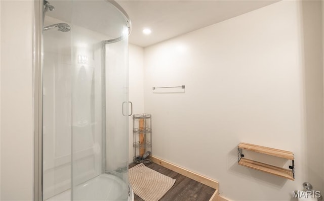 920 E 7th St, Rolla, MO 65401 - full bathroom featuring a stall shower, wood finished floors, and recessed lighting