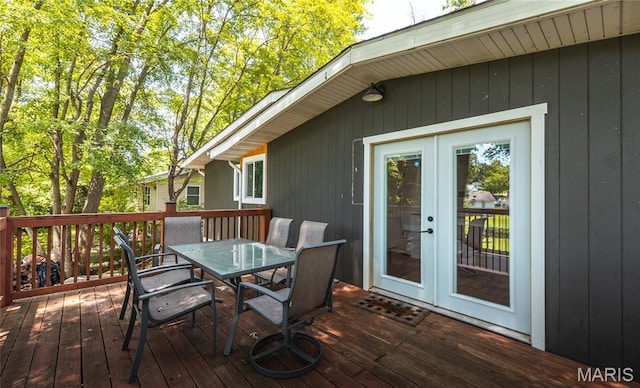 920 E 7th St, Rolla, MO 65401 - wooden terrace featuring outdoor dining area and french doors