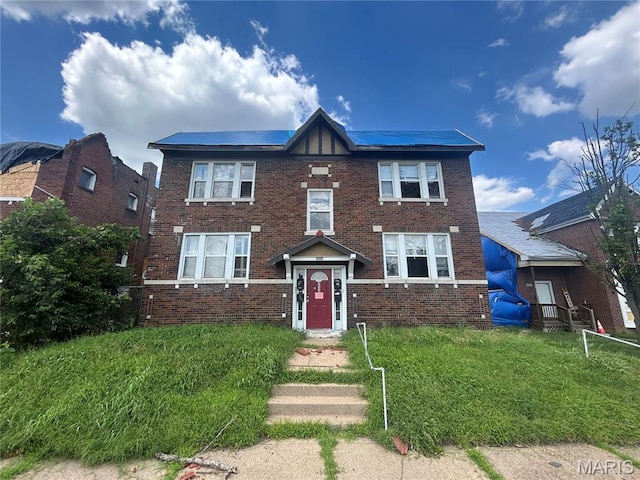 4643 Evans Ave, Saint Louis, MO 63113 - view of front of home with brick siding and a front lawn