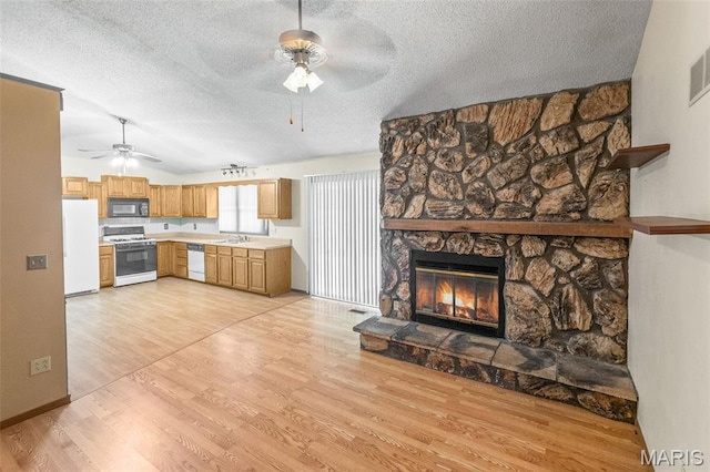 607 Sparrow Ct, Troy, IL 62294 - kitchen featuring white appliances, ceiling fan, a textured ceiling, light countertops, and light wood-type flooring
