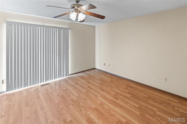 607 Sparrow Ct, Troy, IL 62294 - empty room featuring light wood-style flooring, a ceiling fan, and a textured ceiling