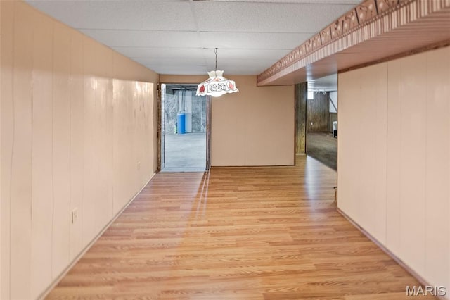 607 Sparrow Ct, Troy, IL 62294 - unfurnished dining area featuring light wood finished floors and wooden walls