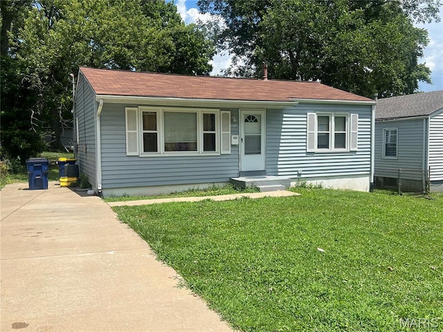 11005 Florence Ave, Saint Ann, MO 63074 - view of front of property featuring a front yard, concrete driveway, and a shingled roof