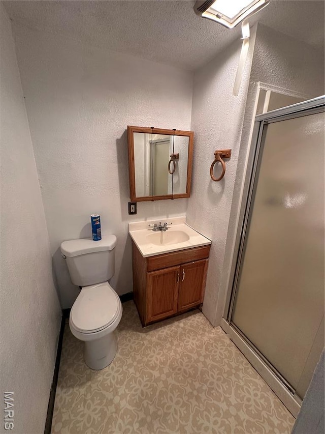 720 Tiffin Ave, Ferguson, MO 63135 - bathroom featuring a stall shower, vanity, a textured wall, and a textured ceiling