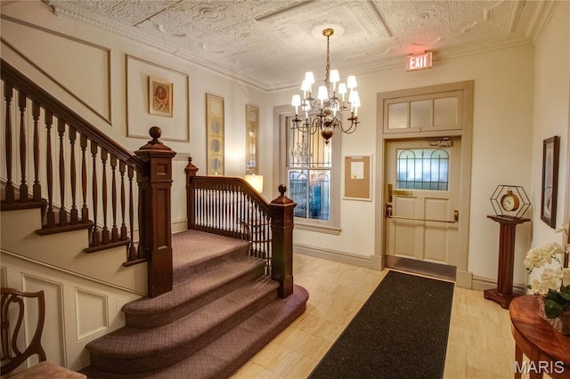 417 Prospect St Unit A, Alton, IL 62002 - entrance foyer with a chandelier, stairs, and an ornate ceiling