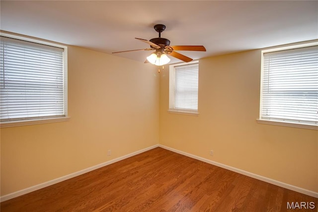 417 Prospect St Unit A, Alton, IL 62002 - unfurnished room featuring wood finished floors, a ceiling fan, and healthy amount of natural light