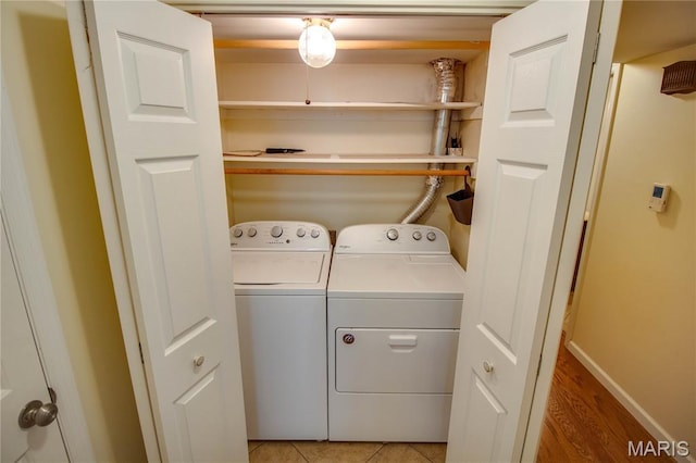 417 Prospect St Unit A, Alton, IL 62002 - laundry area featuring separate washer and dryer and light wood-type flooring