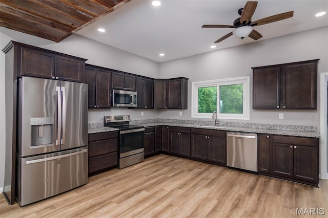 18347 Windy Hill Rd, Staunton, IL 62088 - kitchen featuring stainless steel appliances, dark brown cabinetry, light wood finished floors, a ceiling fan, and recessed lighting