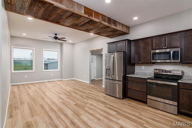 18347 Windy Hill Rd, Staunton, IL 62088 - kitchen with stainless steel appliances, light wood-style floors, dark brown cabinets, ceiling fan, and recessed lighting