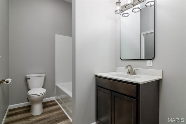 18347 Windy Hill Rd, Staunton, IL 62088 - bathroom featuring vanity, wood finished floors, a bath, and a chandelier