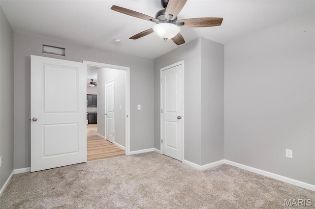 18347 Windy Hill Rd, Staunton, IL 62088 - unfurnished bedroom featuring light colored carpet and ceiling fan