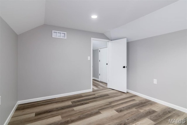 18347 Windy Hill Rd, Staunton, IL 62088 - additional living space featuring lofted ceiling, wood finished floors, and recessed lighting