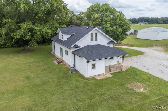 18347 Windy Hill Rd, Staunton, IL 62088 - view of side of property with a shingled roof, driveway, a yard, a porch, and view of scattered trees