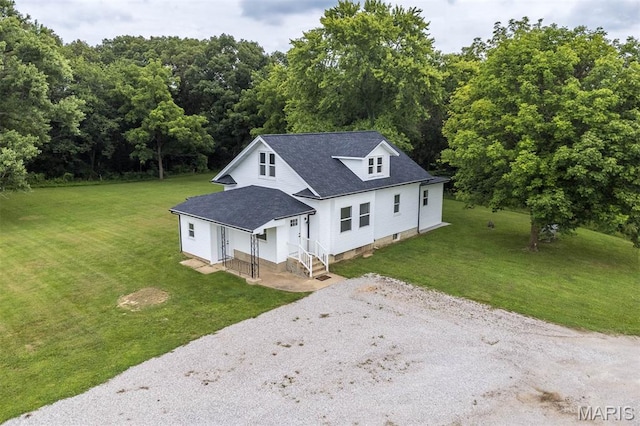 18347 Windy Hill Rd, Staunton, IL 62088 - view of front of home with gravel driveway, a front yard, and roof with shingles