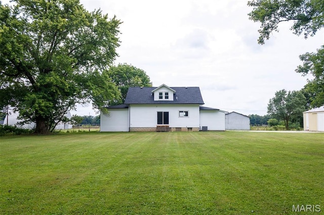 18347 Windy Hill Rd, Staunton, IL 62088 - rear view of house featuring a lawn, entry steps, and a shingled roof