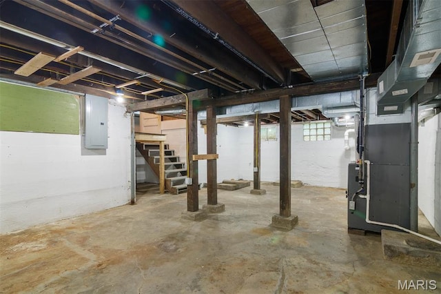 18347 Windy Hill Rd, Staunton, IL 62088 - basement with electric panel, stairway, and heating unit