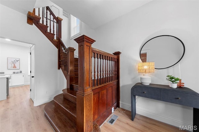 6206 Victoria Ave, Saint Louis, MO 63139 - stairs featuring wood finished floors