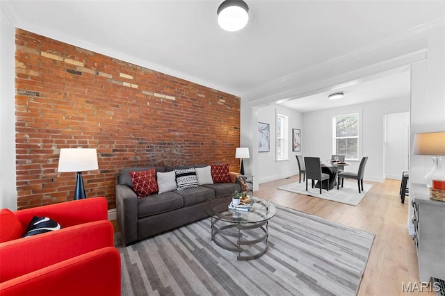 6206 Victoria Ave, Saint Louis, MO 63139 - living room featuring light wood-type flooring and brick wall