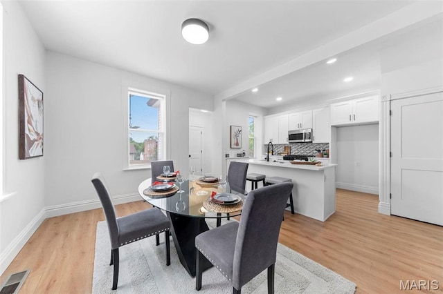 6206 Victoria Ave, Saint Louis, MO 63139 - dining space featuring light wood finished floors and recessed lighting