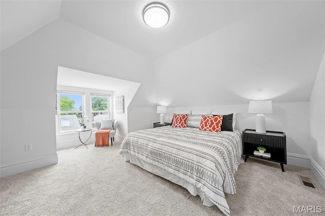 6206 Victoria Ave, Saint Louis, MO 63139 - carpeted bedroom featuring vaulted ceiling and baseboards