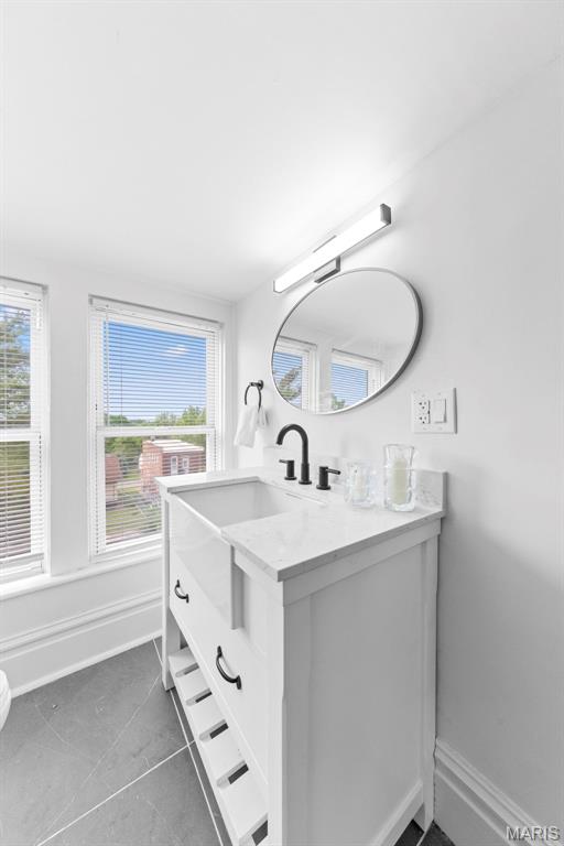 6206 Victoria Ave, Saint Louis, MO 63139 - bathroom with vanity and tile patterned flooring