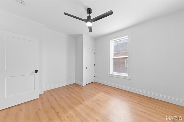 6206 Victoria Ave, Saint Louis, MO 63139 - unfurnished bedroom with light wood finished floors and a ceiling fan