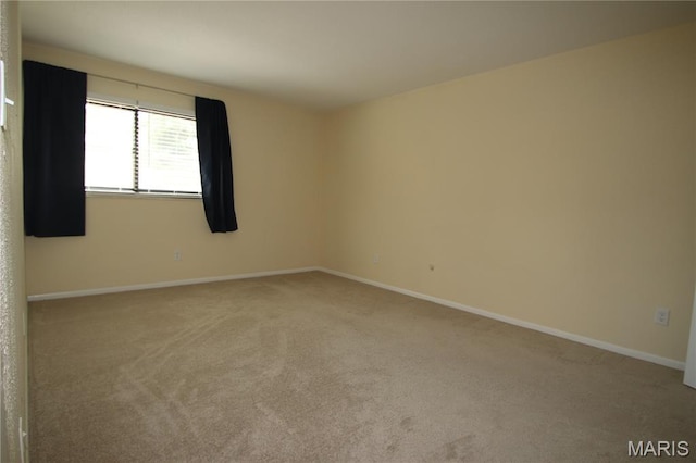 1400 Heritage Lndg Unit 106, Saint Charles, MO 63303 - carpeted empty room featuring baseboards