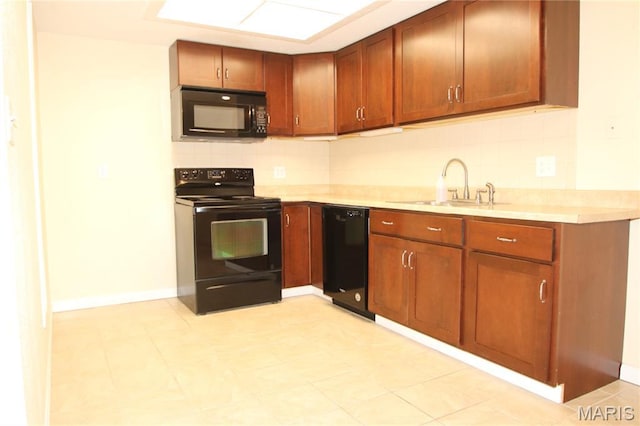 1400 Heritage Lndg Unit 106, Saint Charles, MO 63303 - kitchen with black appliances, decorative backsplash, light countertops, and brown cabinets