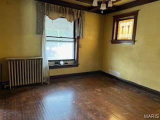 570 Washington Pl E, St Louis, IL 62205 - empty room featuring radiator heating unit and baseboards