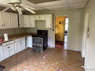 570 Washington Pl E, St Louis, IL 62205 - kitchen featuring stainless steel range, a paneled ceiling, a ceiling fan, and white cabinetry
