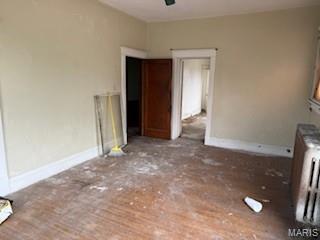 570 Washington Pl E, St Louis, IL 62205 - unfurnished dining area featuring baseboards and ceiling fan