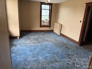 570 Washington Pl E, St Louis, IL 62205 - empty room with radiator heating unit and baseboards