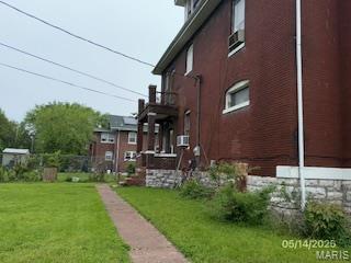 570 Washington Pl E, St Louis, IL 62205 - view of property exterior with a lawn