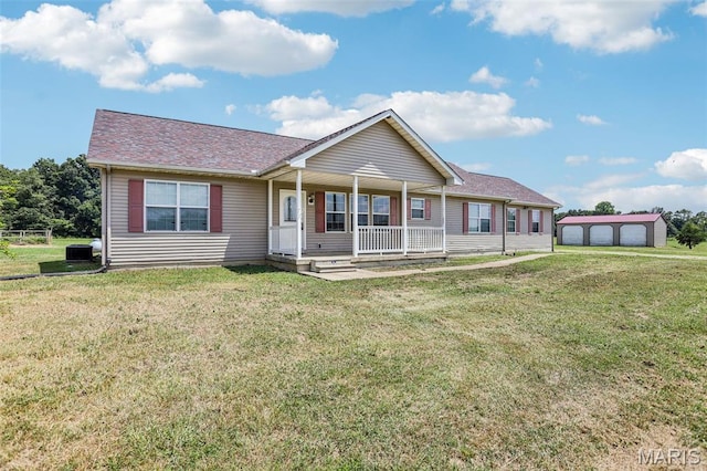 1518 Old Ripley Rd, Sorento, IL 62086 - ranch-style home featuring a porch, a front yard, a shingled roof, and an outbuilding