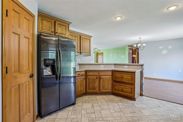 1518 Old Ripley Rd, Sorento, IL 62086 - kitchen featuring fridge with ice dispenser, a peninsula, brown cabinetry, light countertops, and recessed lighting